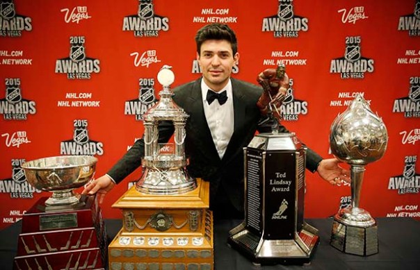 Carey Price of the Montreal Canadiens poses with, from left, the William M. Jennings trophy, the Vezina Trophy, the Ted Lindsay Award trophy and the Art Ross trophy after winning the awards at the NHL Awards show Wednesday, June 24, 2015, in Las Vegas. (AP Photo/John Locher)